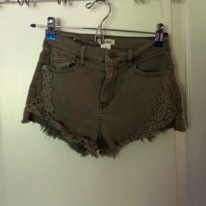 Army green shorts with flower lace on the sides